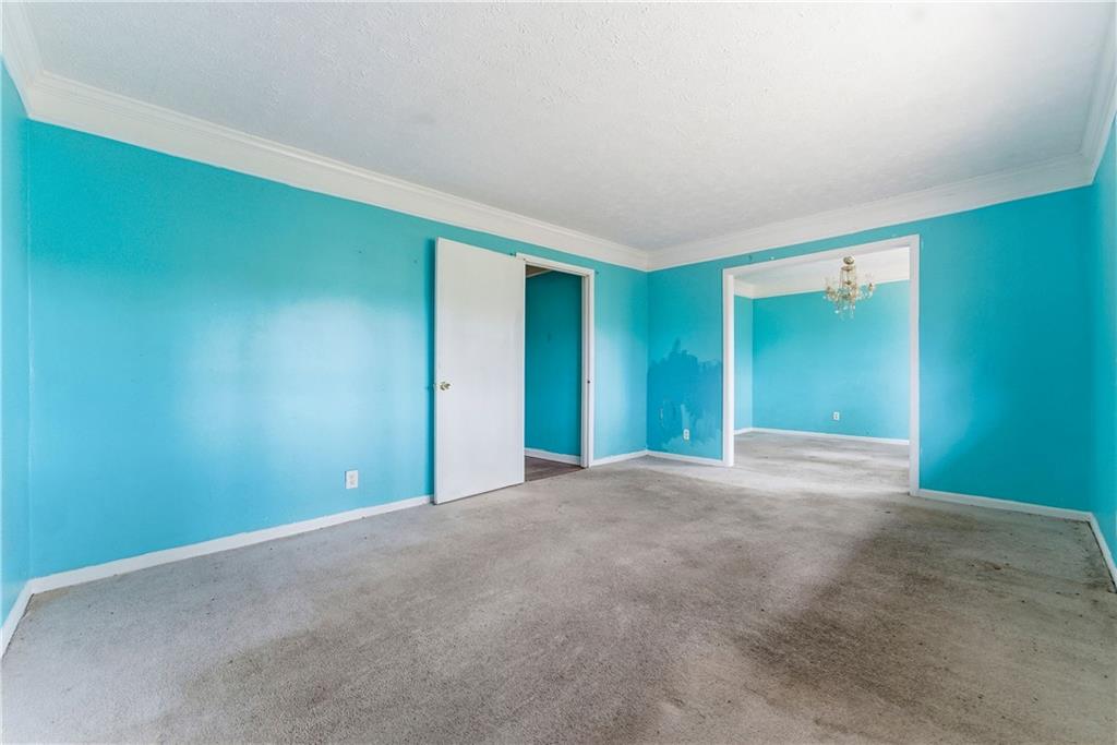 948 Powder Springs Street Marietta, GA 30064 - Photo 4 of 24 a view of an empty room with window and closet area