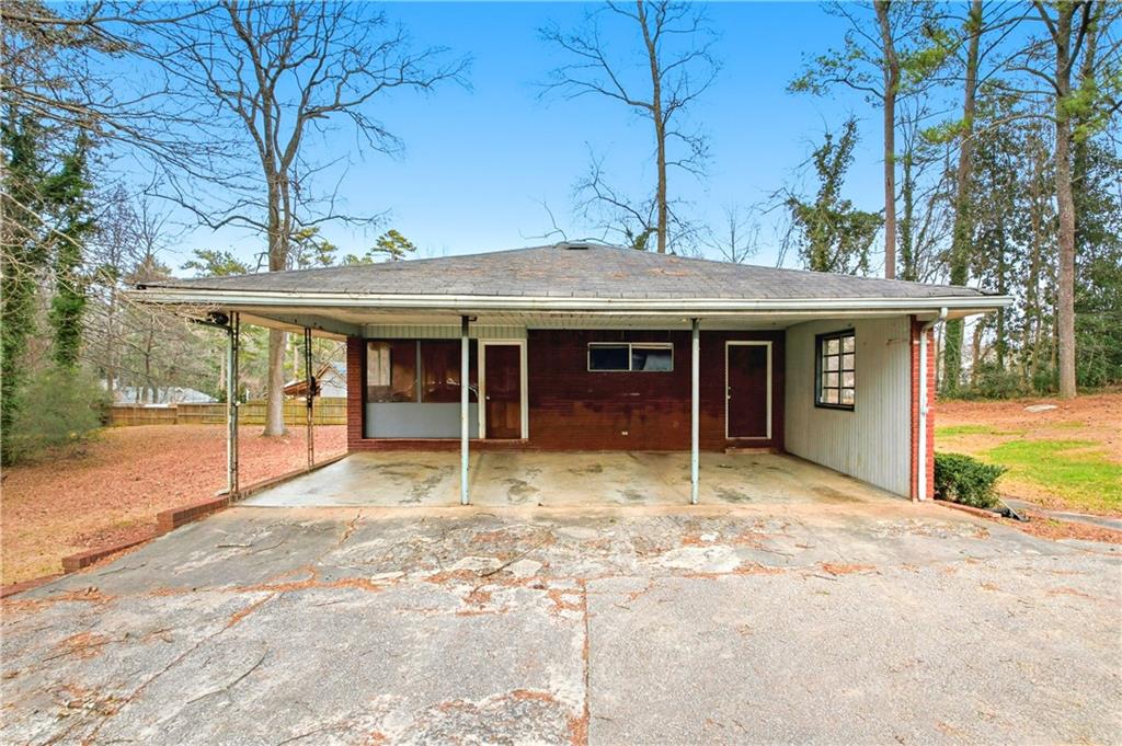 948 Powder Springs Street Marietta, GA 30064 - Photo 6 of 24 a house with yard in front of it