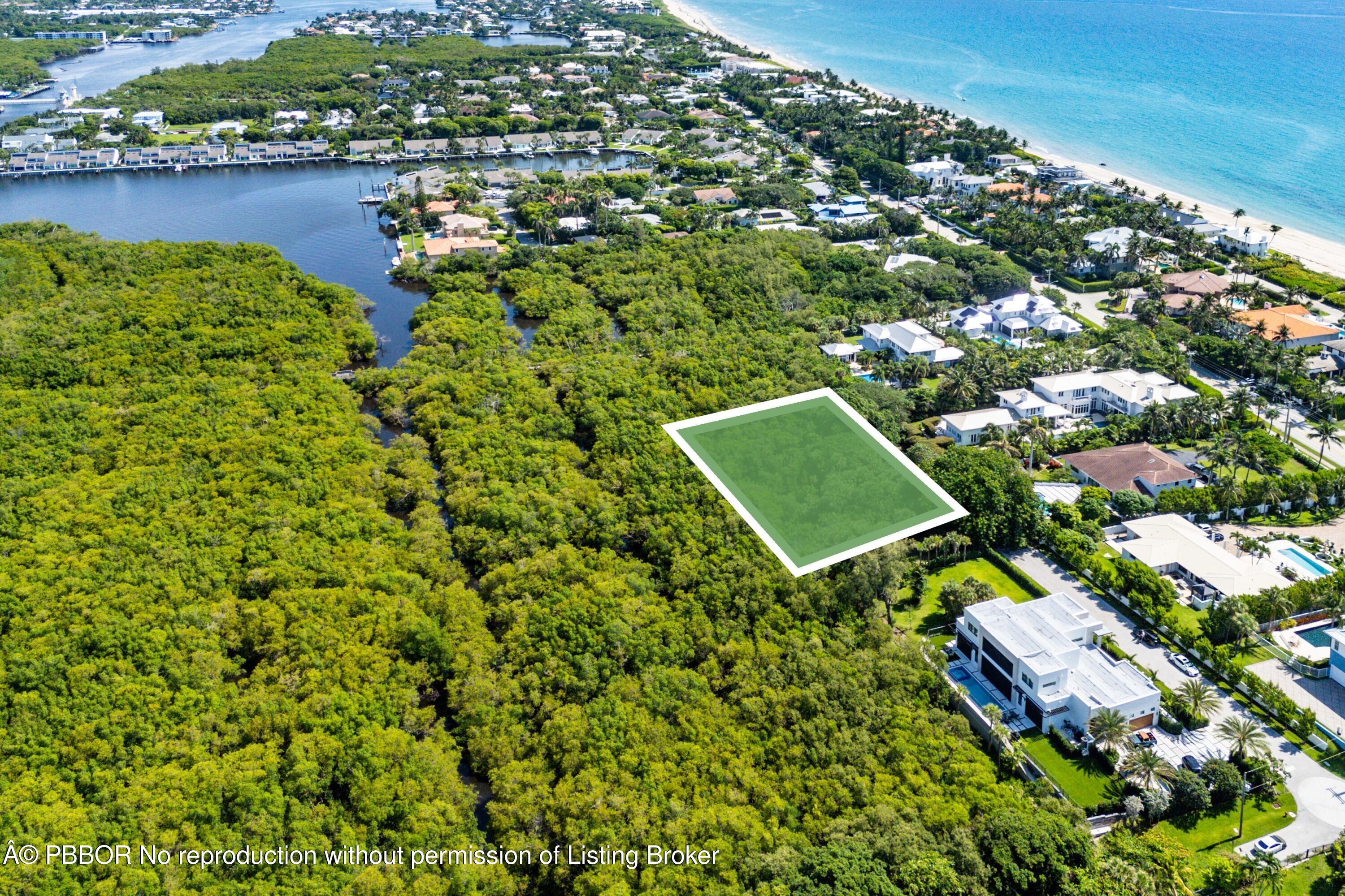 an aerial view of a residential houses with outdoor space and swimming pool