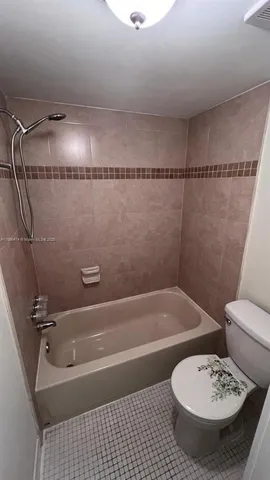 a bathroom with a sink a toilet and a bathtub