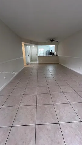 a view of empty room with windows