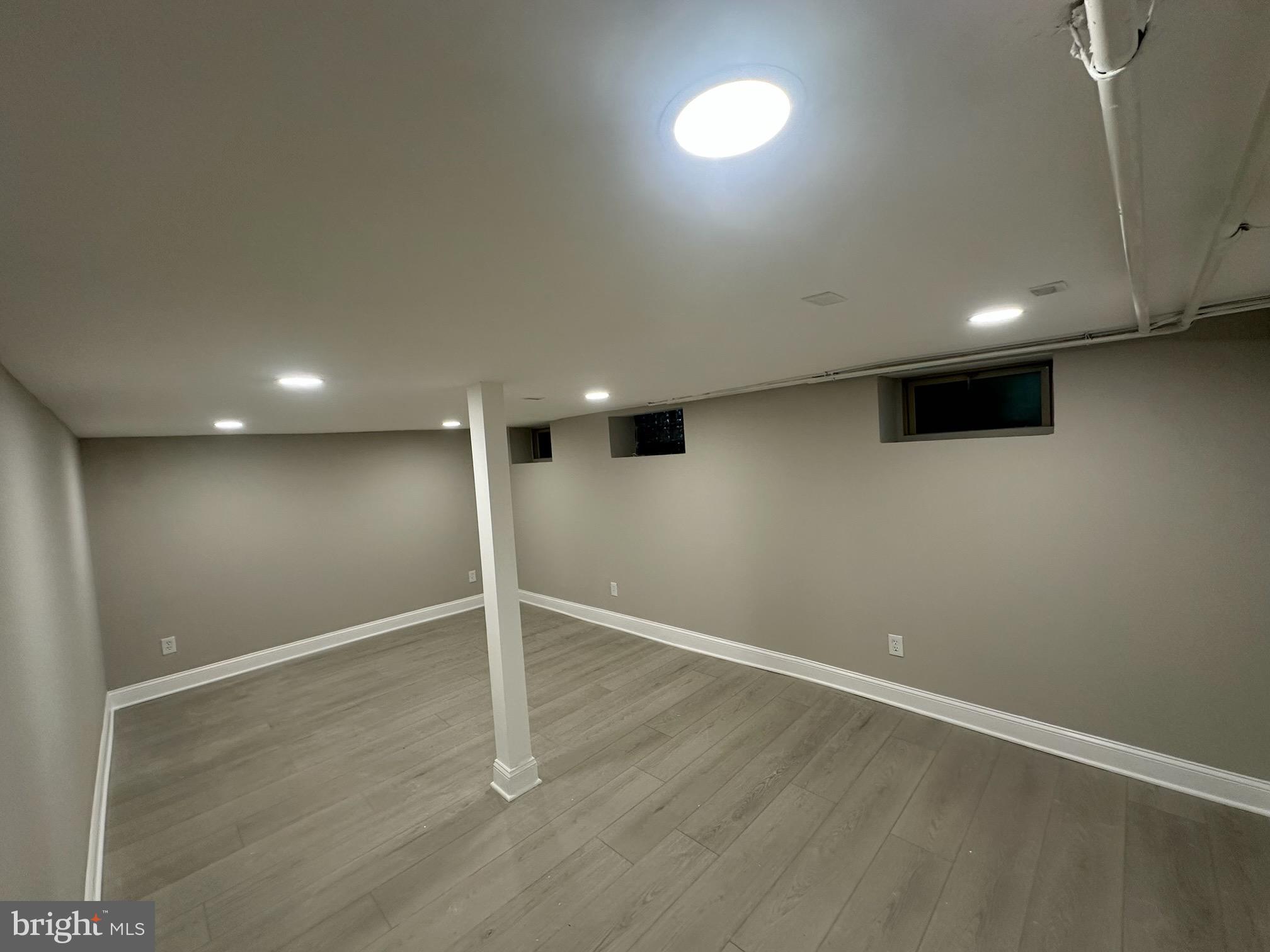 1017 North York Road Willow Grove, PA 19090 - Photo 8 of 8 an empty room with wooden floor and windows