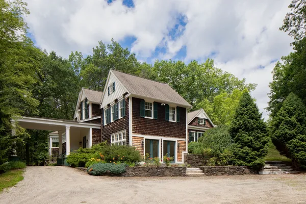 a front view of a house with a yard