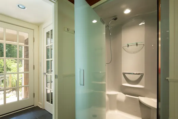 a bathroom with a shower and toilet