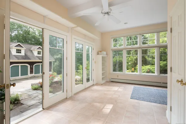 a view of an entryway with wooden floor and windows
