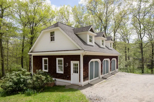 a front view of a house with garden