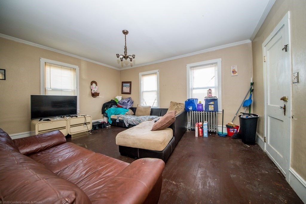 139 Jackson Street Fall River, MA 02721 - Photo 8 of 22 a living room with furniture and a flat screen tv