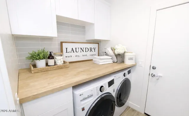 a utility room with dryer and washer