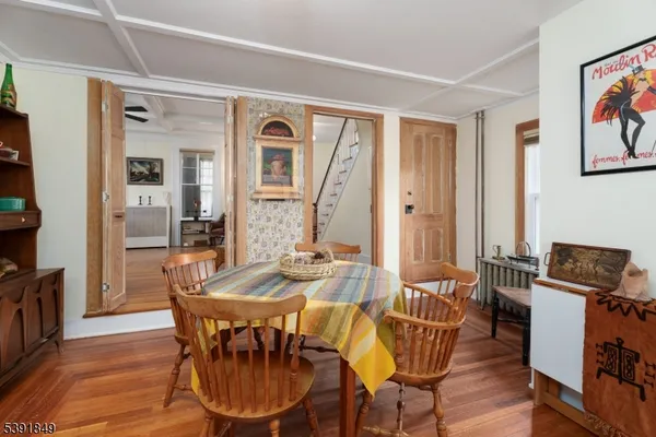 a view of a dining room with furniture window and wooden floor