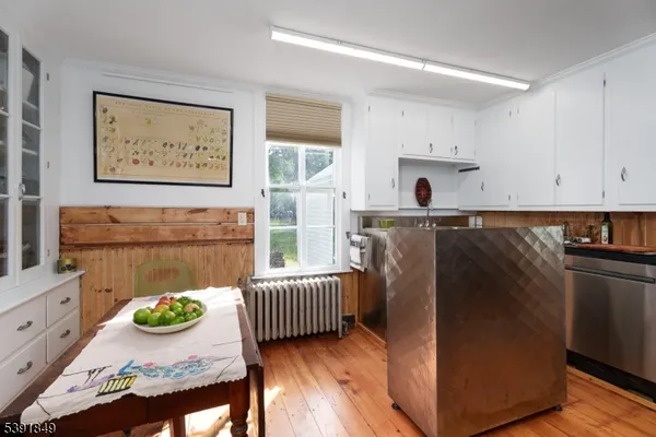 a kitchen with stainless steel appliances granite countertop a refrigerator and a stove