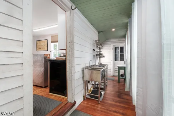 a view of kitchen with furniture and wooden floor
