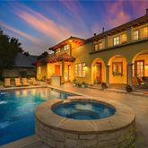a large pool with table and chairs