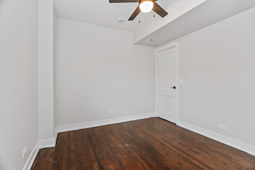 4313 West Parker Avenue Chicago, IL 60639 - Photo 8 of 17 a view of an empty room with wooden floor