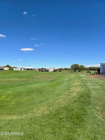a view of a large building with a big yard