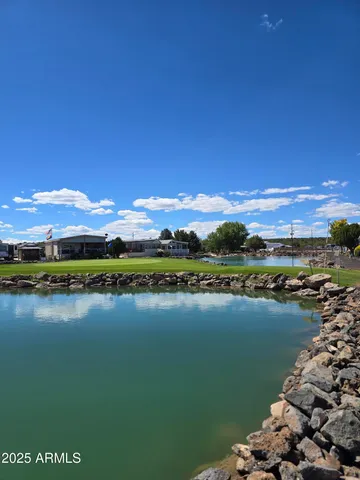 a view of a lake with houses in the back