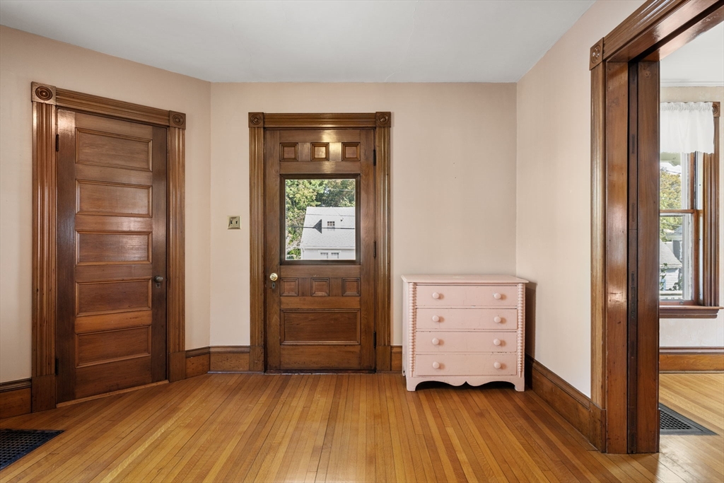 66 Jersey Street Marblehead, MA 01945 - Photo 11 of 31 an empty room with mirror and a window