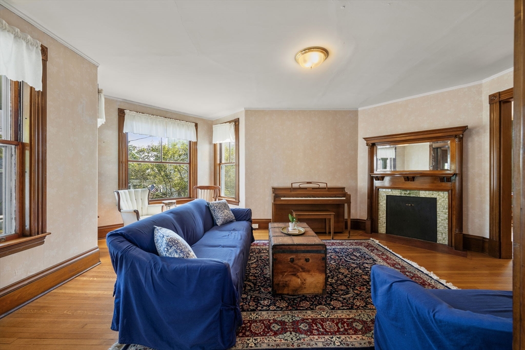 66 Jersey Street Marblehead, MA 01945 - Photo 12 of 31 a living room with furniture a fireplace and a window