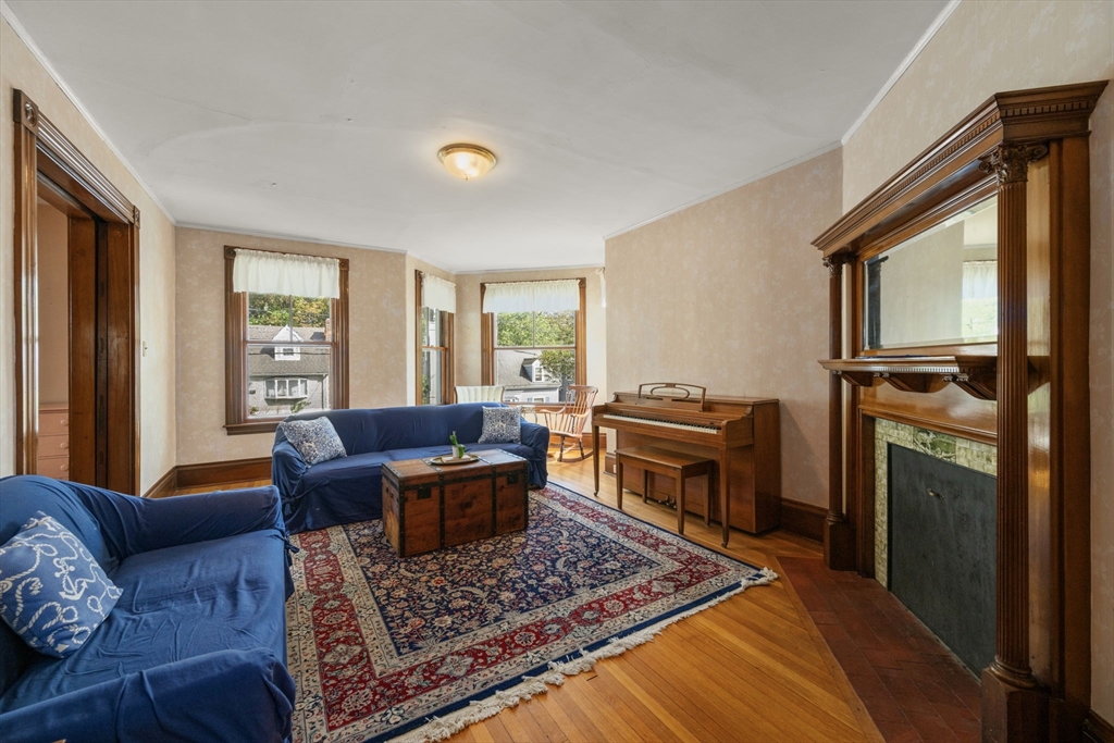 66 Jersey Street Marblehead, MA 01945 - Photo 14 of 31 a living room with furniture a flat screen tv and a window