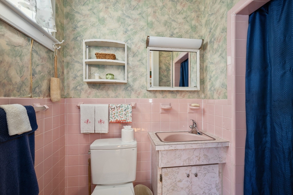 66 Jersey Street Marblehead, MA 01945 - Photo 17 of 31 a bathroom with a sink and a mirror