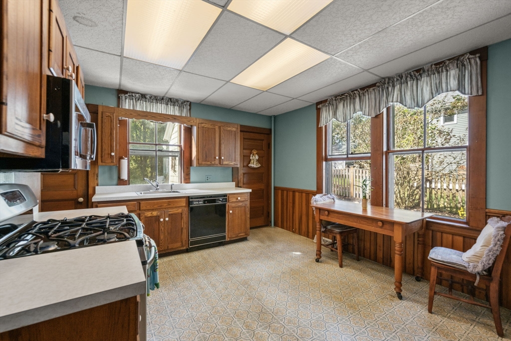 66 Jersey Street Marblehead, MA 01945 - Photo 18 of 31 a kitchen with a stove a sink and a refrigerator
