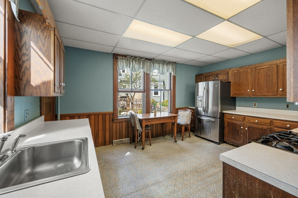 66 Jersey Street Marblehead, MA 01945 - Photo 19 of 31 a kitchen that has a sink and a table in it