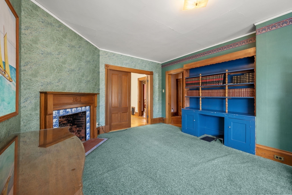 66 Jersey Street Marblehead, MA 01945 - Photo 26 of 31 a bedroom with furniture and a fireplace