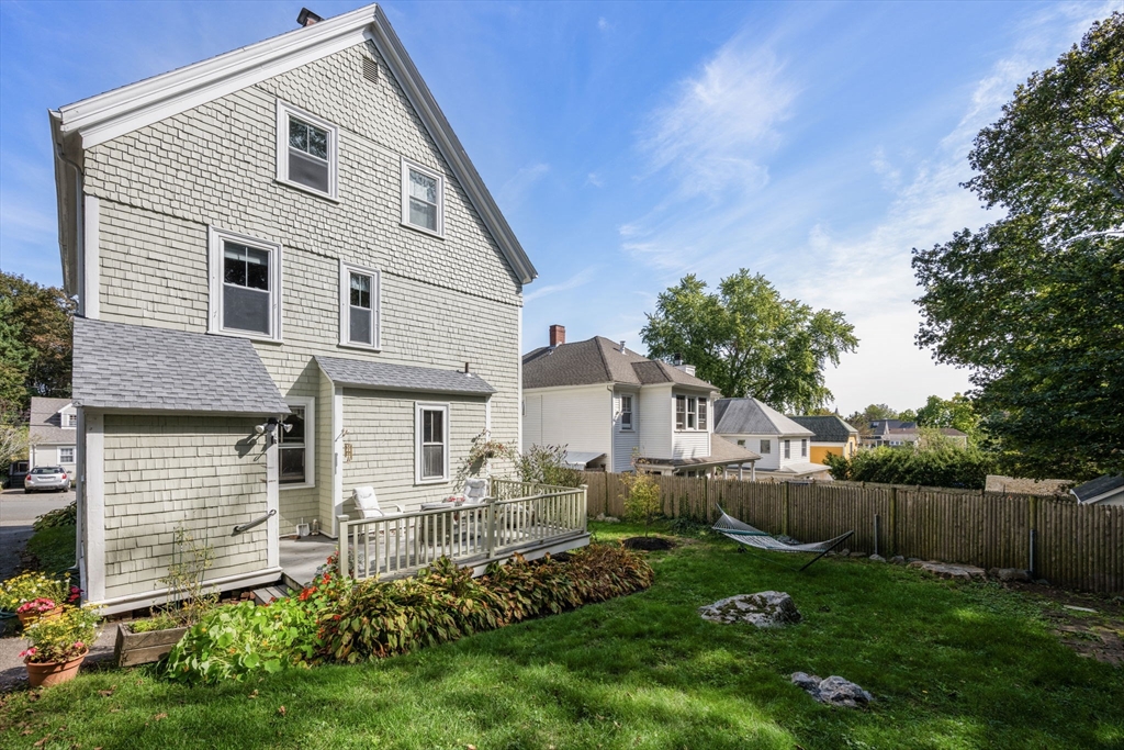 66 Jersey Street Marblehead, MA 01945 - Photo 4 of 31 a front view of a house with a yard and trees