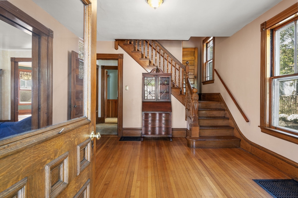 66 Jersey Street Marblehead, MA 01945 - Photo 9 of 31 a view of an entryway with wooden floor and door
