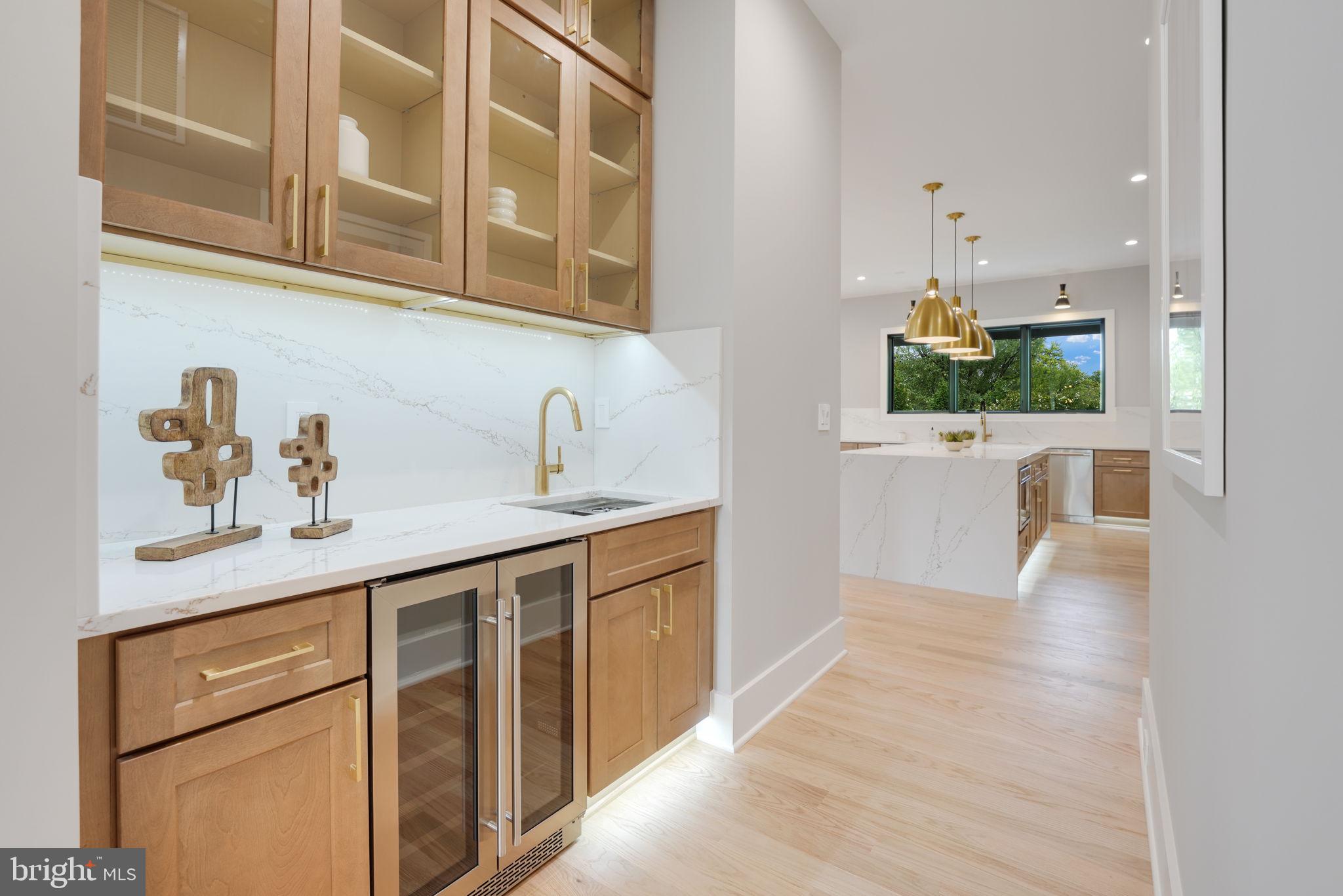 7925 Falstaff Road McLean, VA 22102 - Photo 26 of 58 a hallway with sink and wooden floor