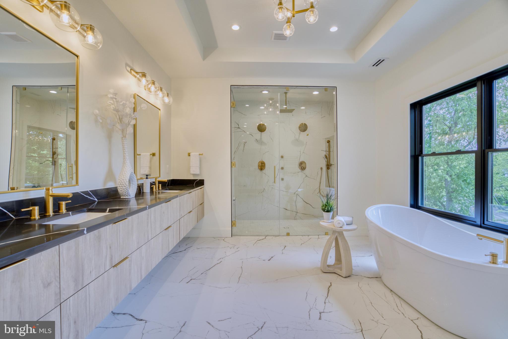 7925 Falstaff Road McLean, VA 22102 - Photo 36 of 58 a large spacious bathroom with a large tub shower and sink