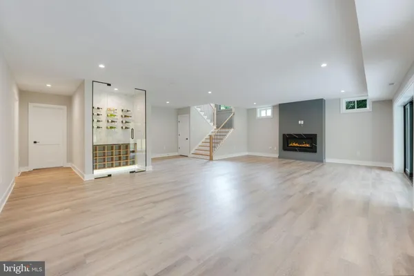 a kitchen with a sink a counter top space and stainless steel appliances