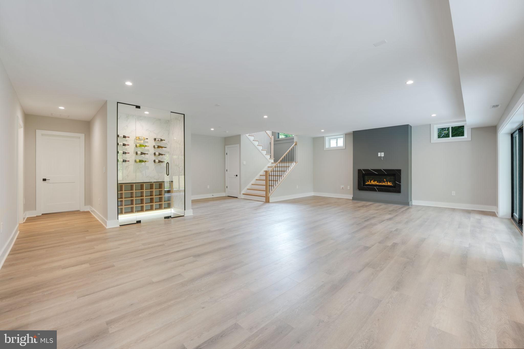 7925 Falstaff Road McLean, VA 22102 - Photo 48 of 58 a view of an empty room with a fireplace and a window