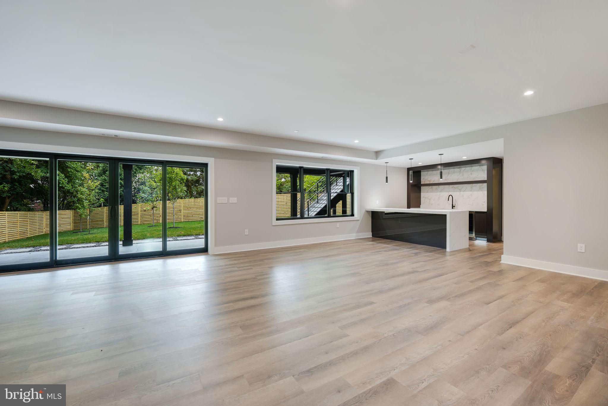 7925 Falstaff Road McLean, VA 22102 - Photo 49 of 58 a view of an empty room with wooden floor and a window