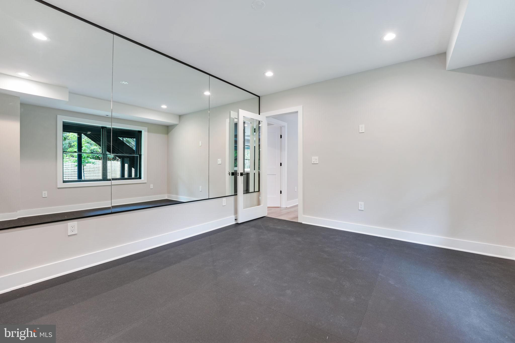 7925 Falstaff Road McLean, VA 22102 - Photo 52 of 58 an empty room with a empty space and windows