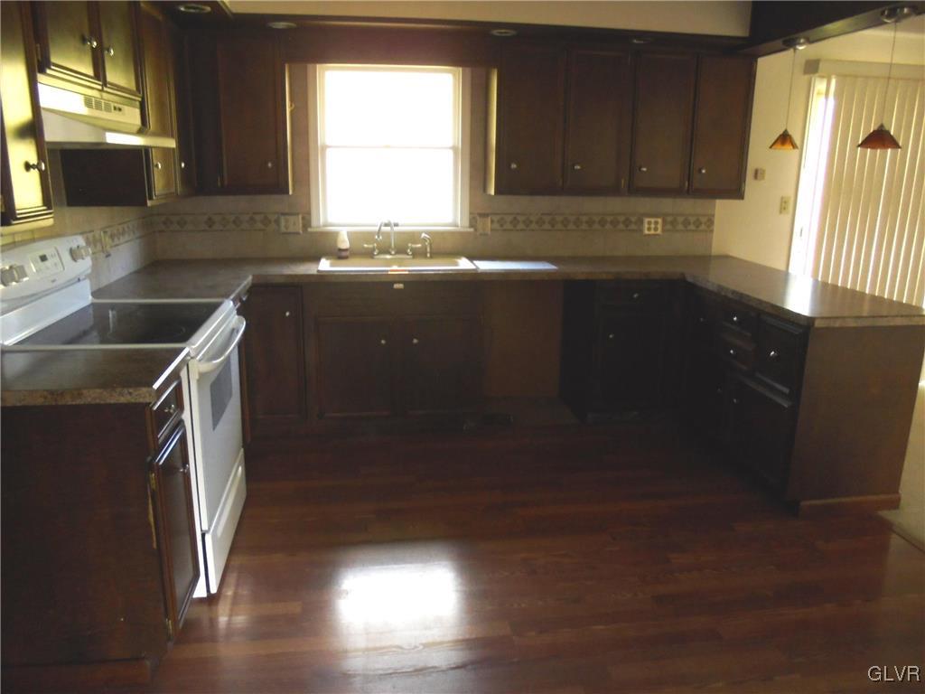 297 Kunkletown Road Kunkletown, PA 18058 - Photo 5 of 29 a kitchen with a sink a window and cabinets