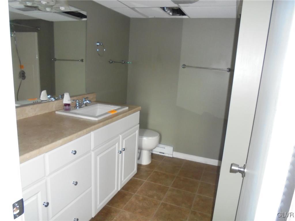 297 Kunkletown Road Kunkletown, PA 18058 - Photo 7 of 29 a bathroom with a sink a toilet and a mirror