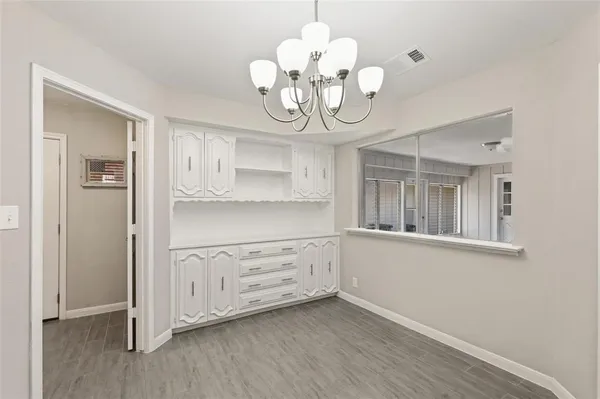 a view of a storage & utility room with wooden floor