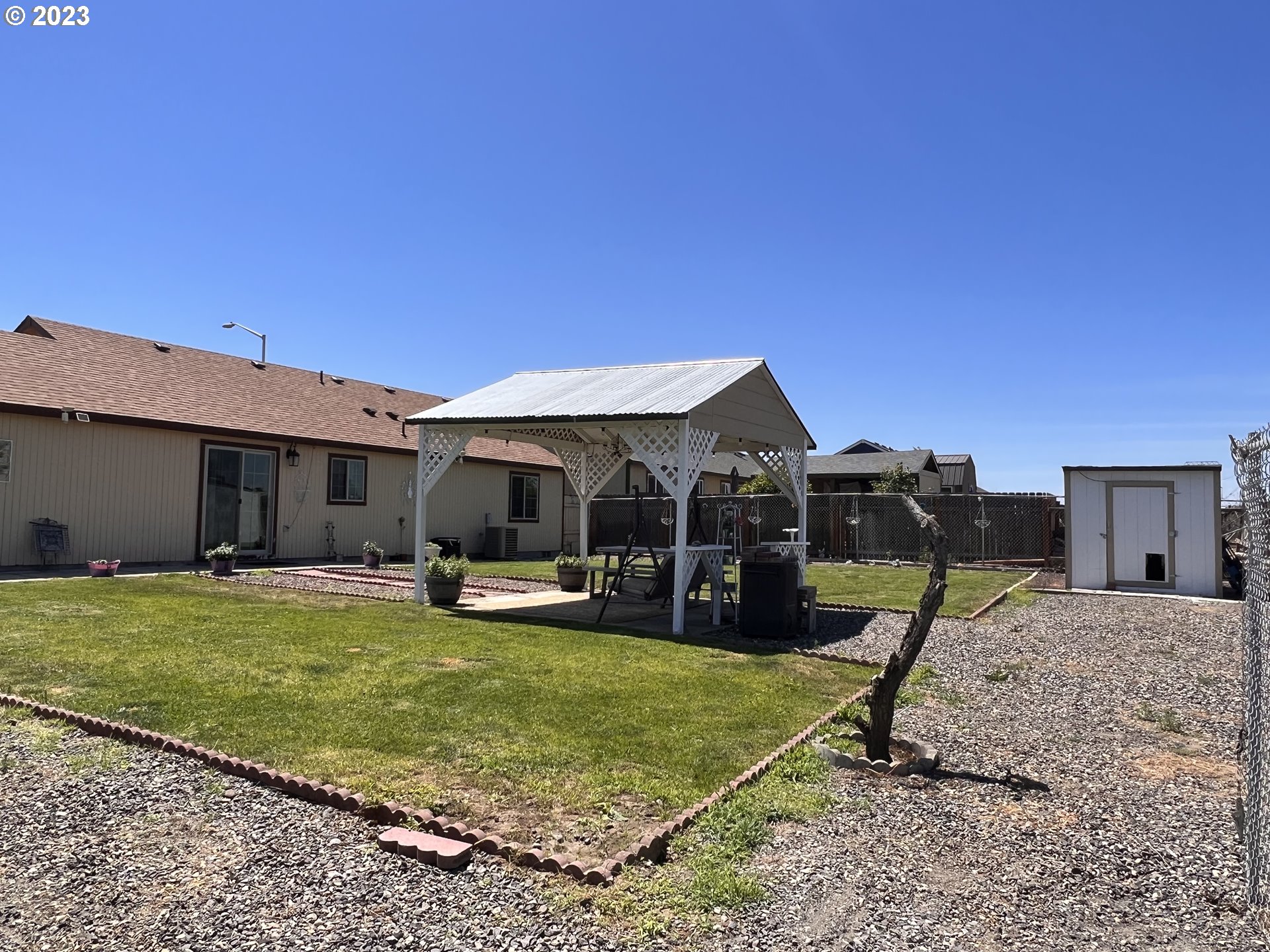 155 Pine Tree Avenue Umatilla, OR 97882 - Photo 13 of 15 a view of a house with a backyard