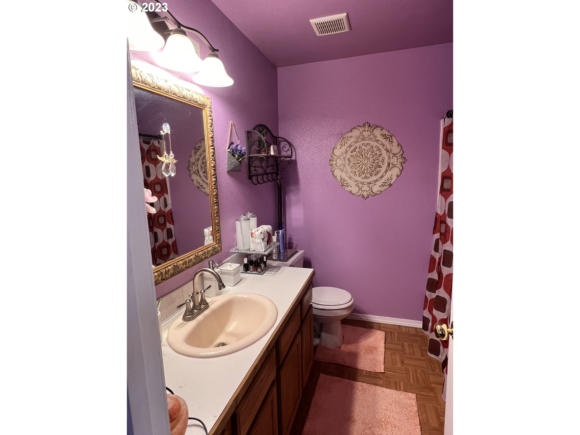 155 Pine Tree Avenue Umatilla, OR 97882 - Photo 10 of 15 a bathroom with a sink mirror vanity and toilet