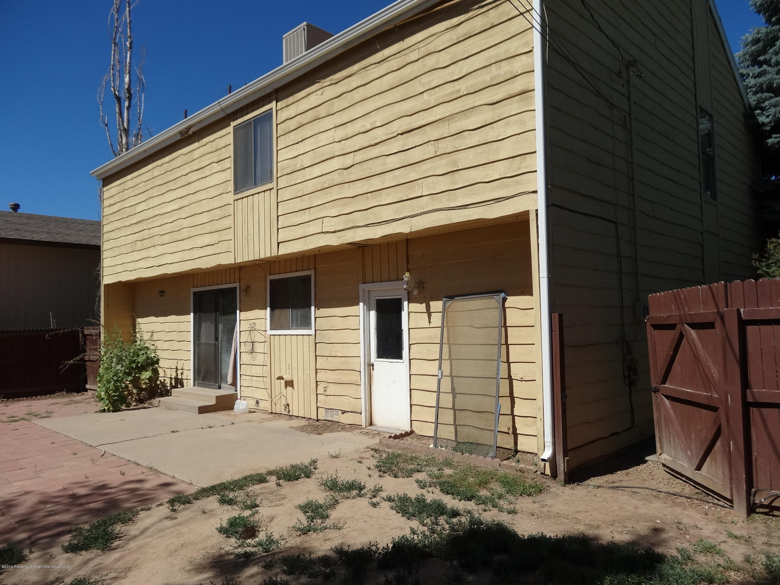 416 Will Avenue Rifle, CO 81650 - Photo 12 of 14 a front view of a house with a yard