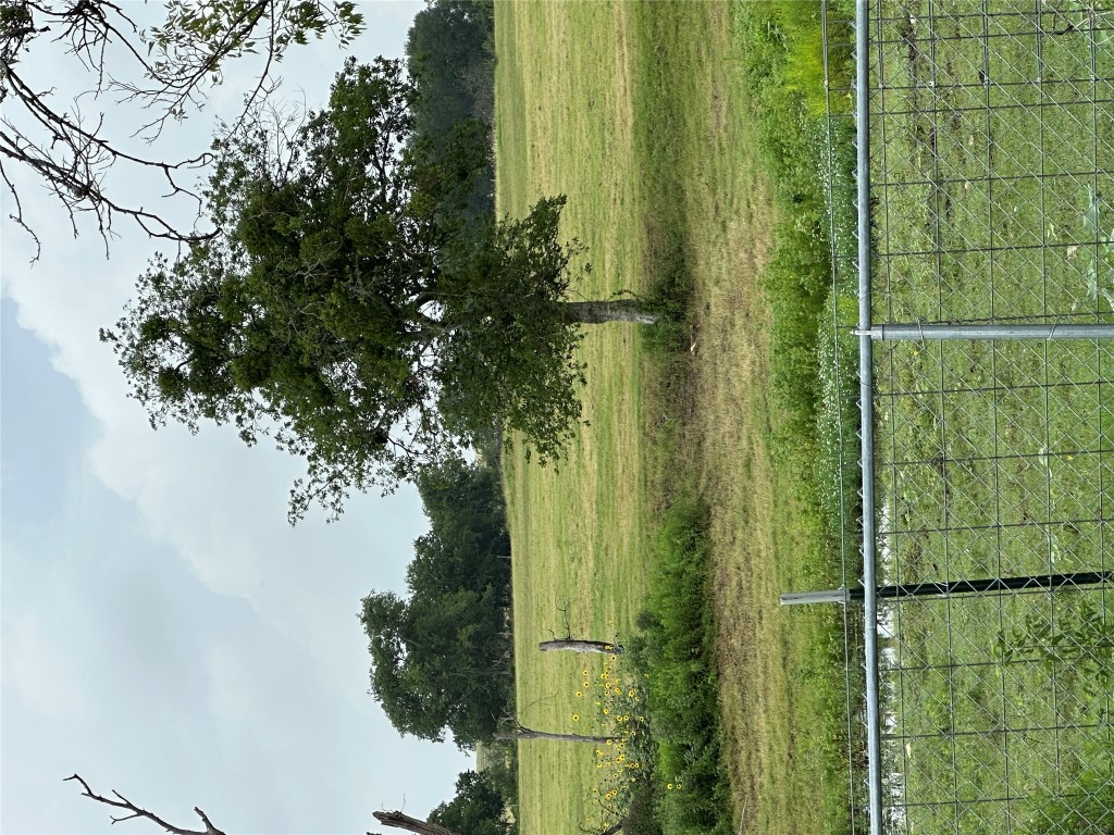3007 County Road 303 Jarrell, TX 76537 - Photo 32 of 36 a view of a golf course with a lake