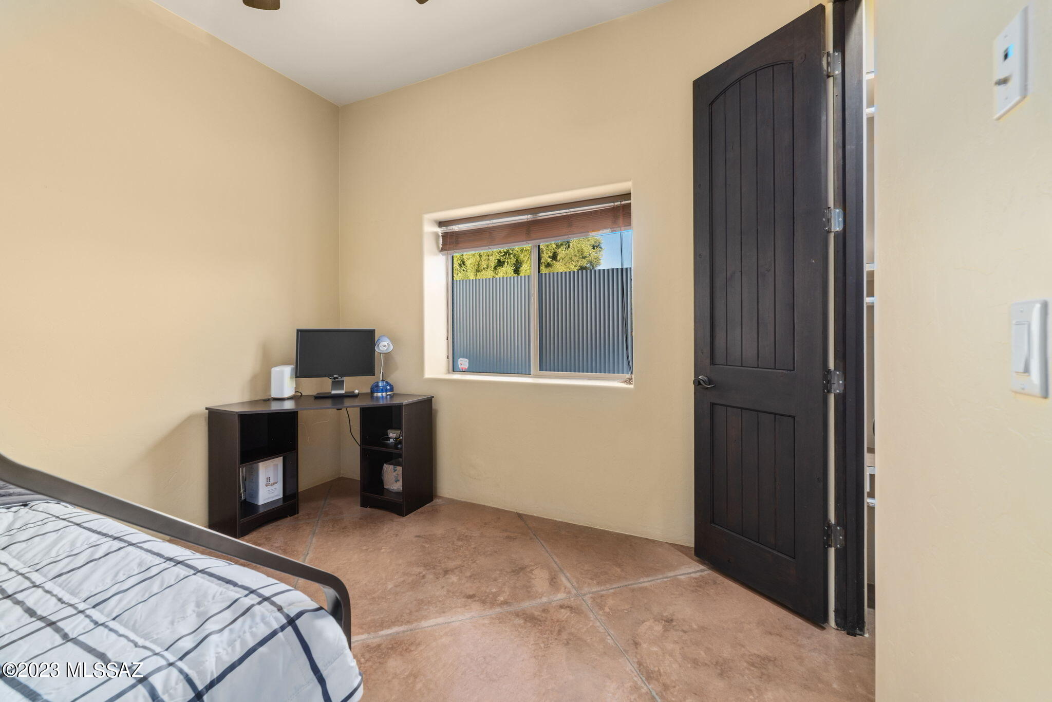 5670 Triangle X Place Tucson, AZ 85713 - Photo 15 of 36 a bedroom with a bed and a window