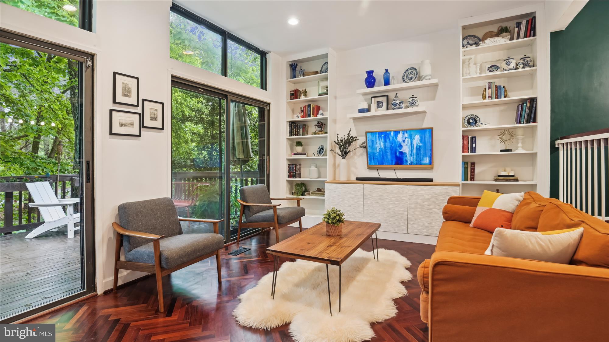 1551 Scandia Circle Reston, VA 20190 - Photo 3 of 41 Wall of Windows and Built-Ins in the Living Room.
