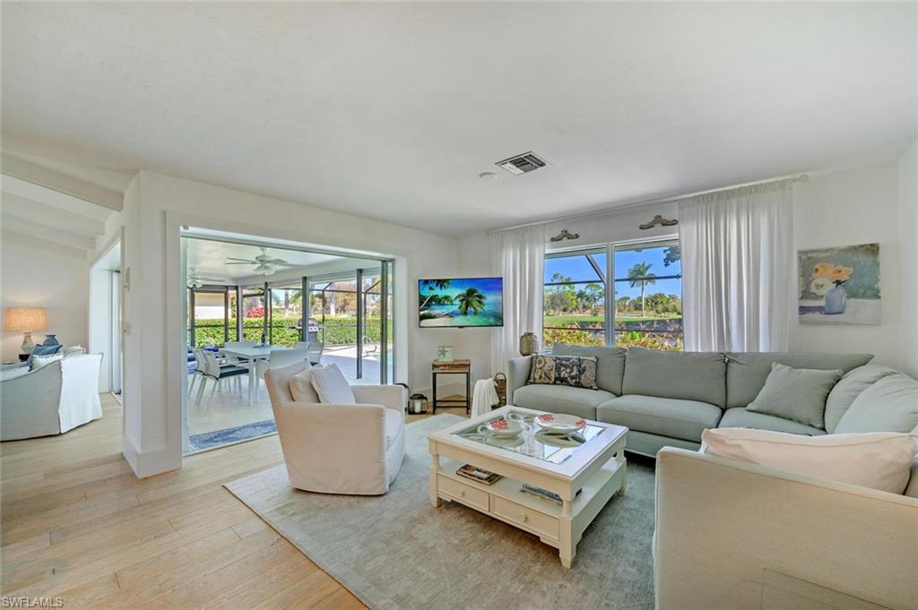 239 Torrey Pines Point Naples, FL 34113 - Photo 20 of 36 a living room with furniture and a window