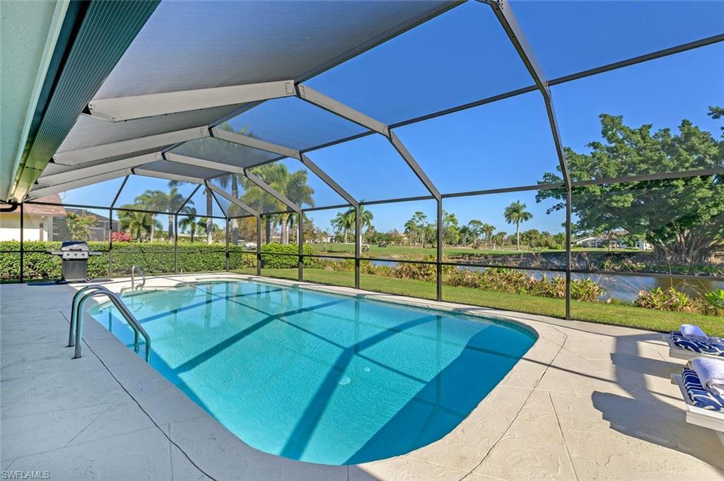 239 Torrey Pines Point Naples, FL 34113 - Photo 9 of 36 a view of swimming pool with seating area