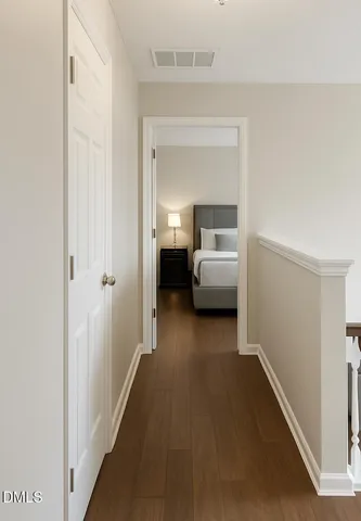 a view of a bedroom from a hallway