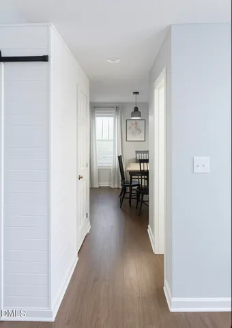 a view of a livingroom with furniture and wooden floor