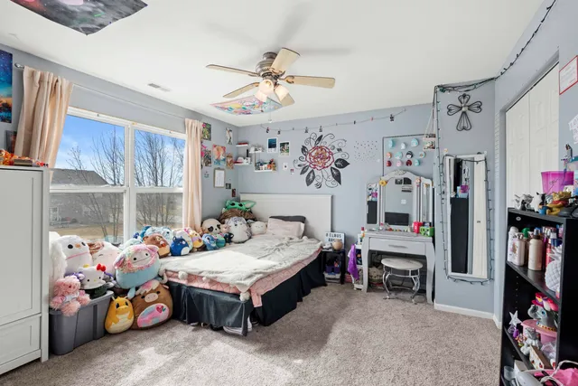 a bed room with furniture and a flat screen tv