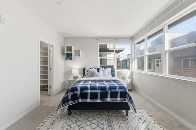 a bedroom with a bed and window