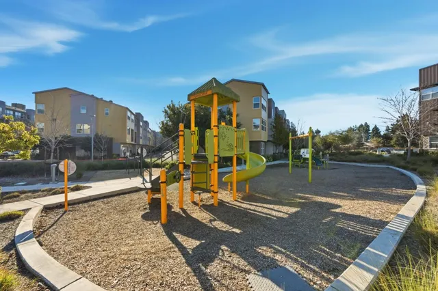 a view of a park with swings